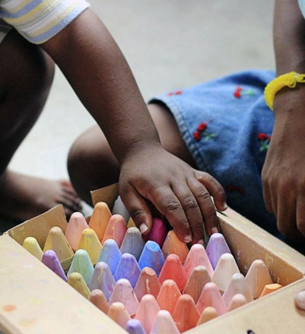 Child exploring crayons